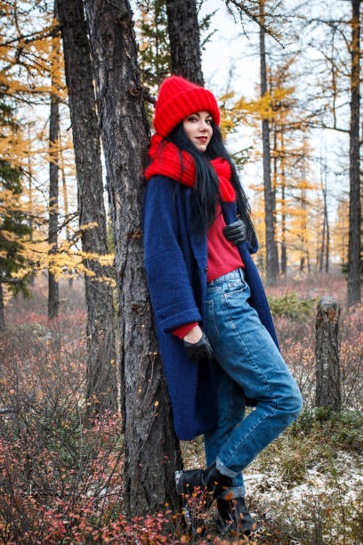 istock Pretty young woman walking in the forest 976560262