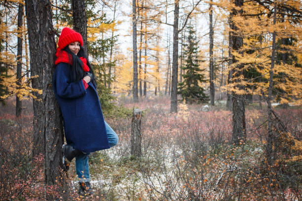 istock Pretty young woman walking in the forest 976560264
