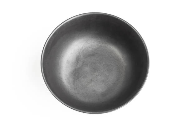 istock ceramic bowl isolated on the white background / Top view black empty bowl isolated on white background 976560376
