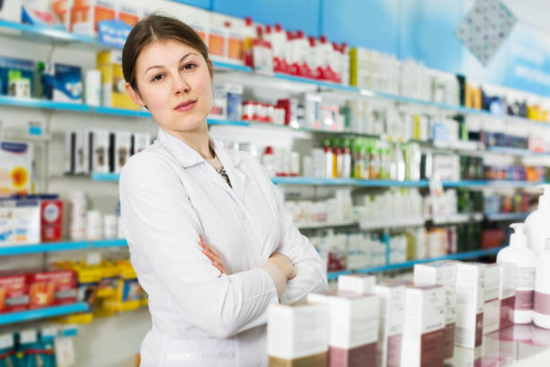 istock Female pharmacist in modern drugstore 976563382