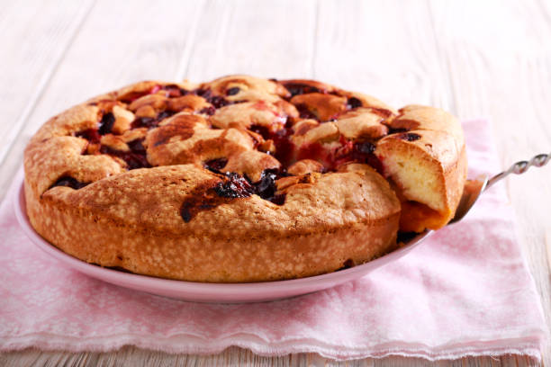istock Fruit and berry sponge cake, sliced 976564014