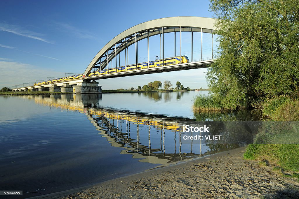 Railway bridge with train  Netherlands Stock Photo