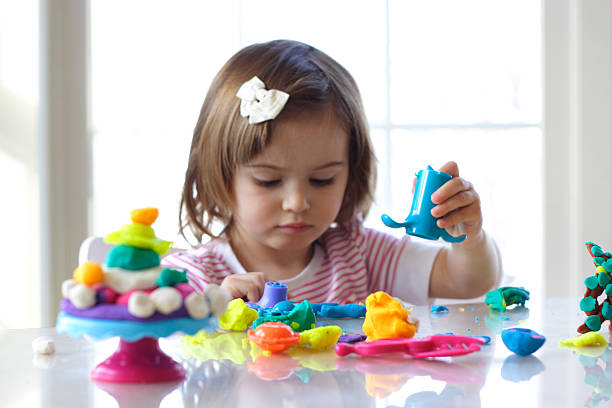 istock Girl playing with play dough 97656889