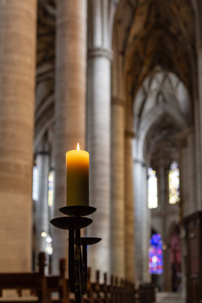 istock candlelight in church nave altar 976569800