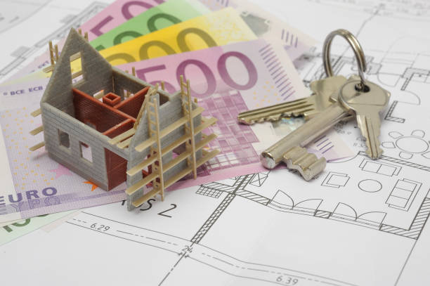 istock house keys and money laying on blueprint plan 976569924