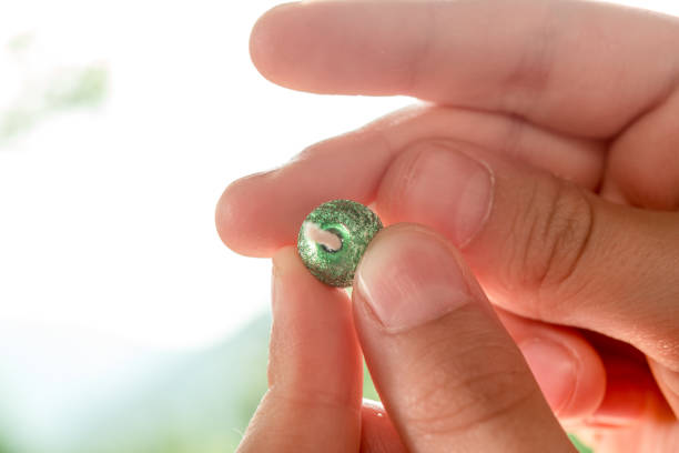 istock Close Up Girl Hands  Working On Beads At Table 976573130