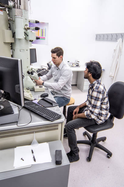 istock Young Scientists Discussing in the Laboratory 976578604