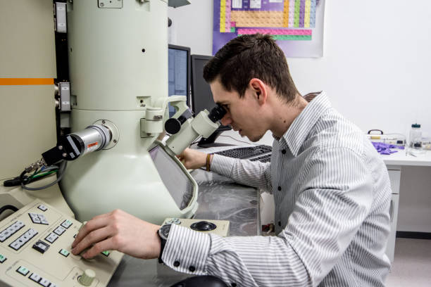 istock Male Scientist Looking Inro Field Emission Electron Microscope 976578612