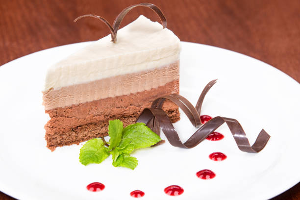 istock Caramel cake, mousse dessert on a plate. 976579016