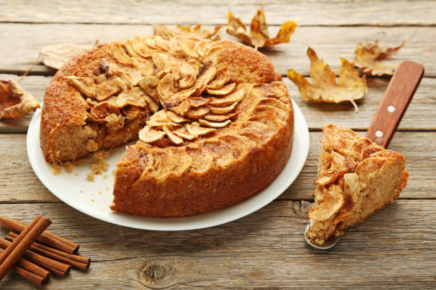 istock Apple cake in plate on grey wooden table 976582038