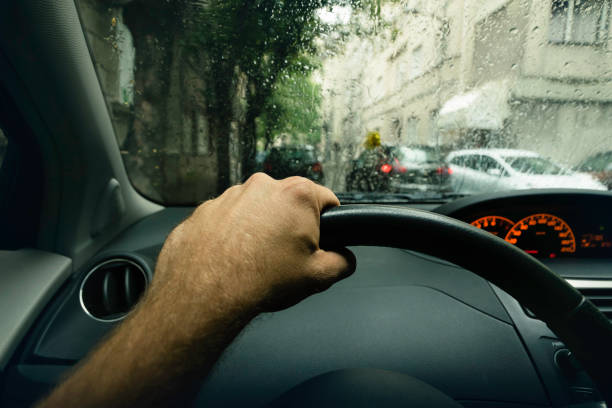 Driving a car on a rainy day.