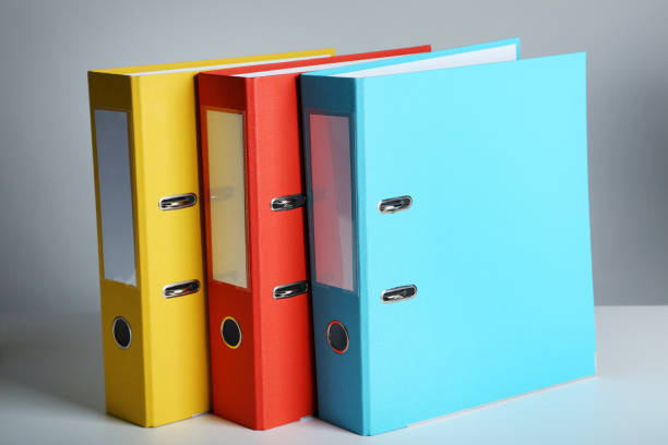 istock Colorful office folders on grey background 976592000