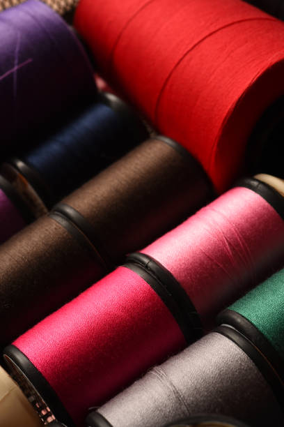 istock close up of colorful thread spools 976592120