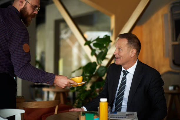istock Businessman in coffee shop 976597554