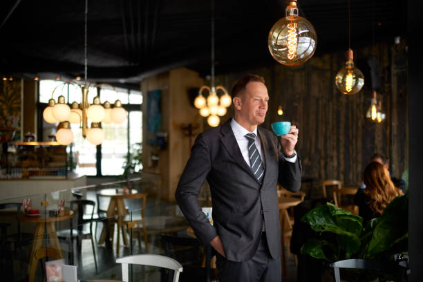 istock Businessman in coffee shop 976597822