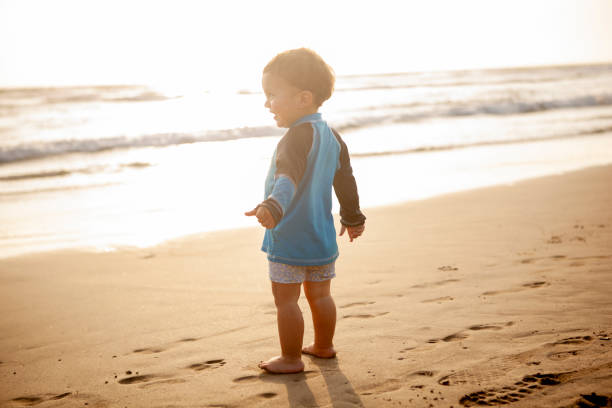 istock Toddler enjoying the beach 976601292