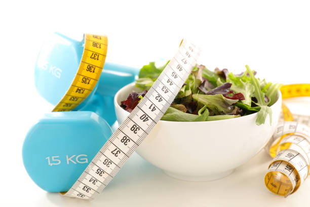 istock salad and dumbbell 976601704