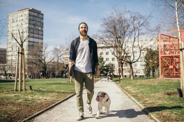 istock Man and dog in the park 976604120
