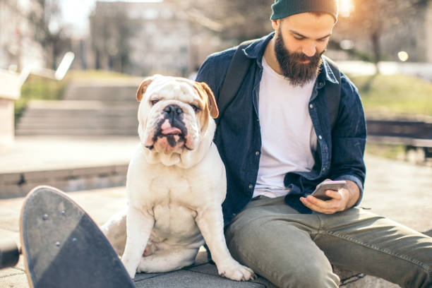 istock Man and dog in the park 976604500