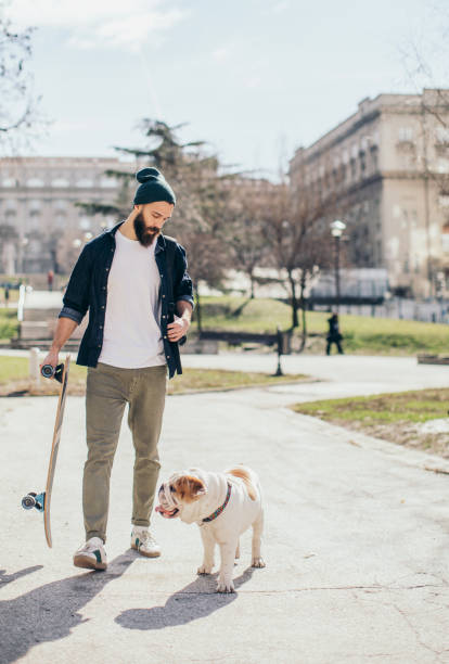istock Man and dog in the park 976604664