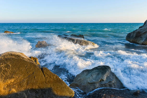 istock Sea waves and rocky beach 976604710