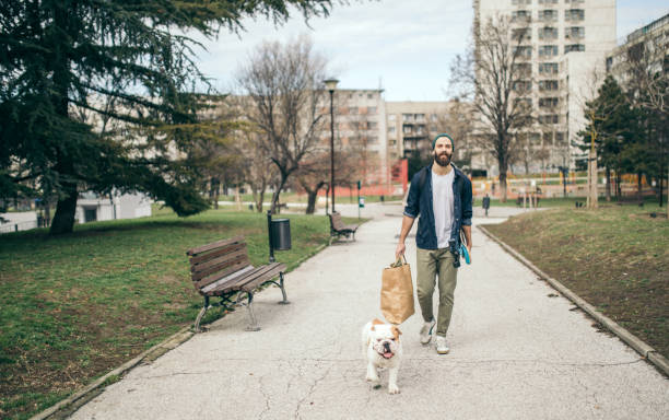 istock Man and dog in the park 976607672