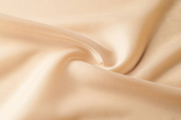 Texture background of fabric. Beige fabric. Silk fabric wallpaper texture background pattern in sepia pastel yellow cream beige tint: Lovely natural silk textured textile