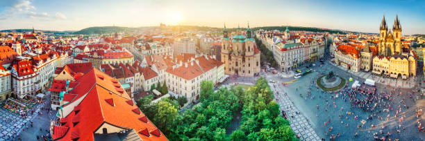 high definition panoramic aerial view from old town square in Prague Panoramic aerial view of Prague at sunset, Czech Republic st nicholas church prague stock pictures, royalty-free photos & images