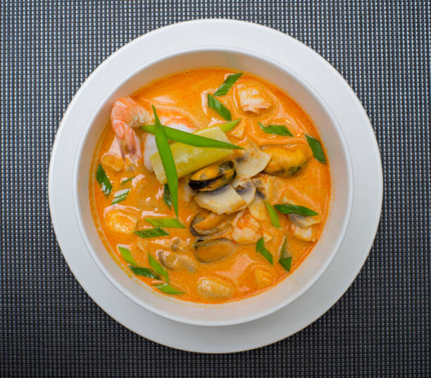 istock Seafood soup on the table. Shrimp, mussel, tomatoes. 976616402