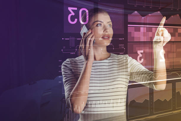 istock IT manager talking on the phone and looking at the screen 976616500