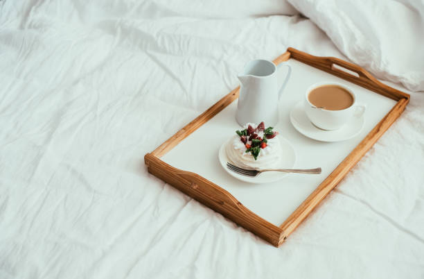 istock Cozy home breakfast in bed in white bedroom interior 976620138