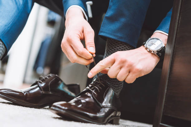 istock Businessman tying his shoelaces 976620652