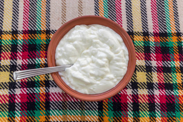 Traditional bulgarian yogurt in a traditional bowl Eating a traditional bulgarian yogurt from a bowl bulgarian culture photos stock pictures, royalty-free photos & images