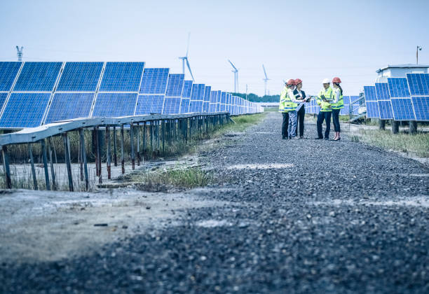 istock Engineers and business developers discuss construction plans at the new power and energy equipment base. 976633472