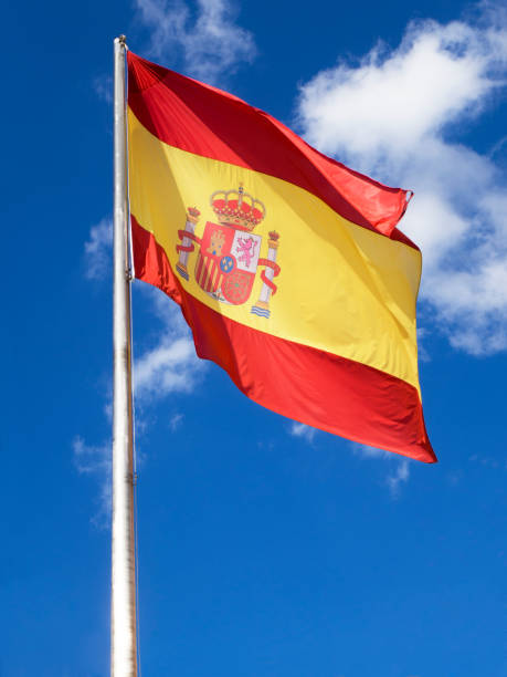 istock Flag of Spain waving on a blue sky. 976633732