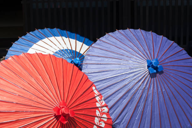 istock Three paper umbrellas 976638660