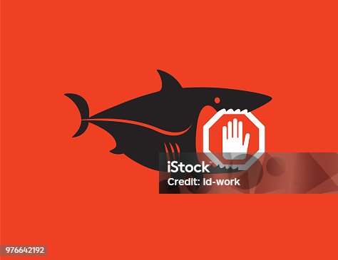 istock shark holding stop sign 976642192