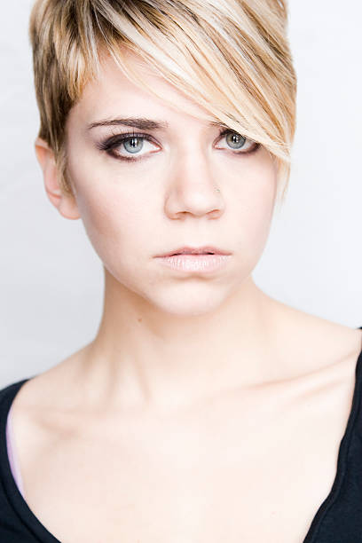 istock Beautiful blonde with blue eyes and pixie haircut 97666051