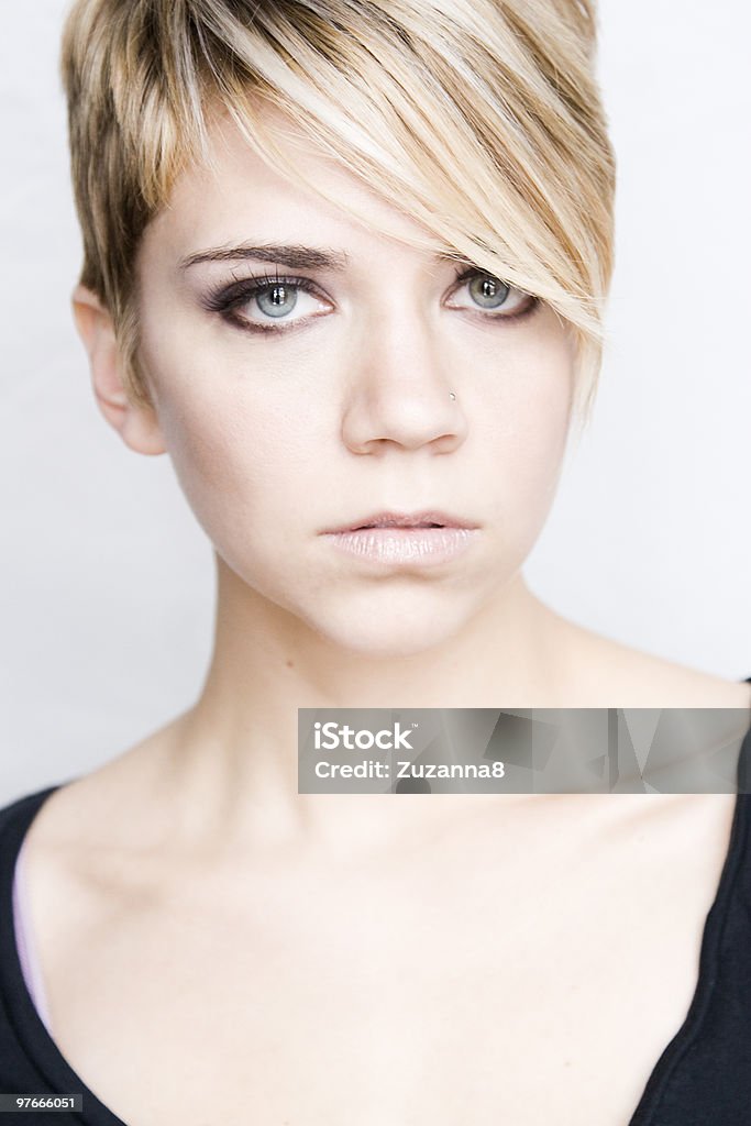 Beautiful blonde with blue eyes and pixie haircut  Adult Stock Photo