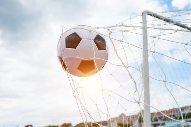 istock Soccer ball hitting the net 976661918