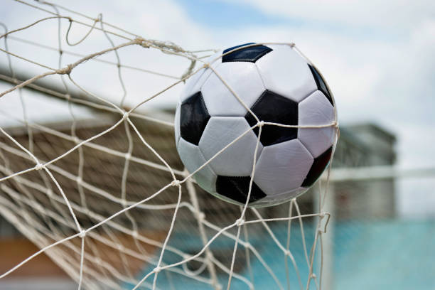 istock Soccer ball hitting the net 976661928