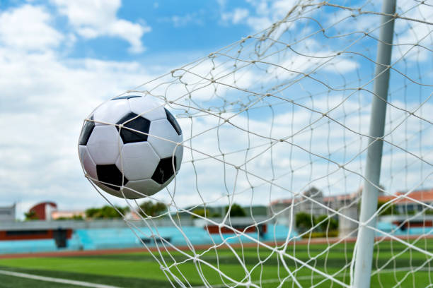istock Soccer ball hitting the net 976662108