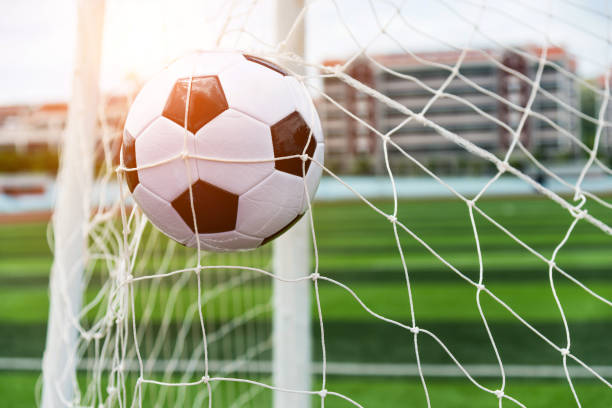 istock Soccer ball hitting the net 976662208