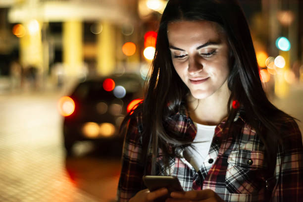 istock Pretty young woman using her phone 976670762