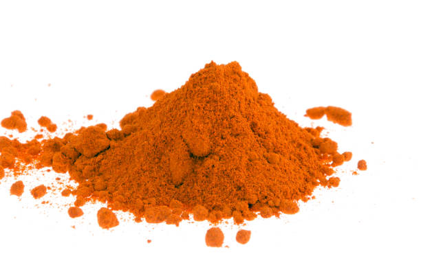 istock red paprika powder on white background 976671672