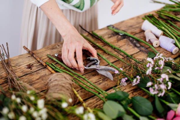 istock Florist makes a bouquet. 976680710