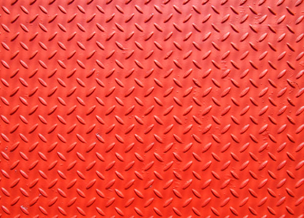 istock red painted industrial metal plate industrial diamond pattern grip texture 976683770
