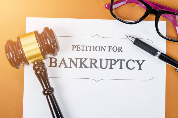 istock Bankruptcy document with wooden judge gavel 976684836