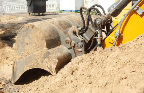 istock Excavator with excavator shovel on a construction site 976685574