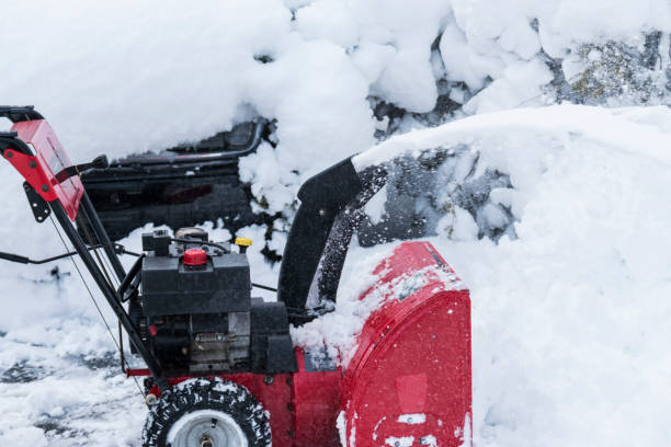 istock Red snow blower clearing a path after a blizzard 976685734